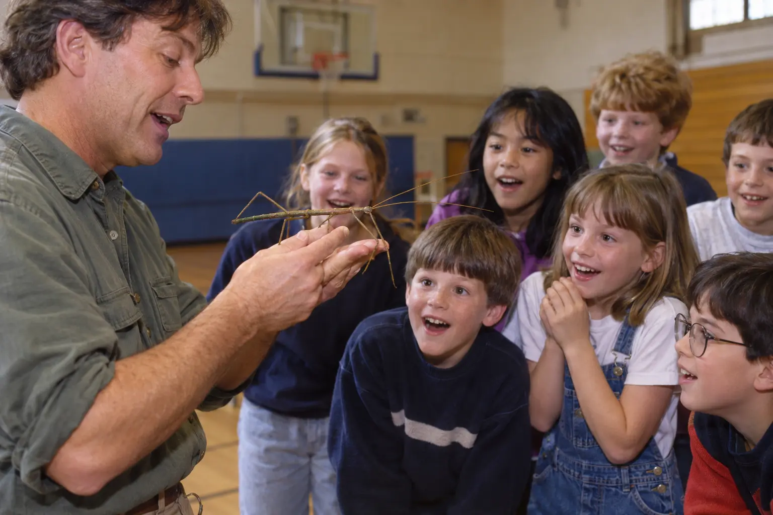 Children react to an invertebrate during a live science presentation